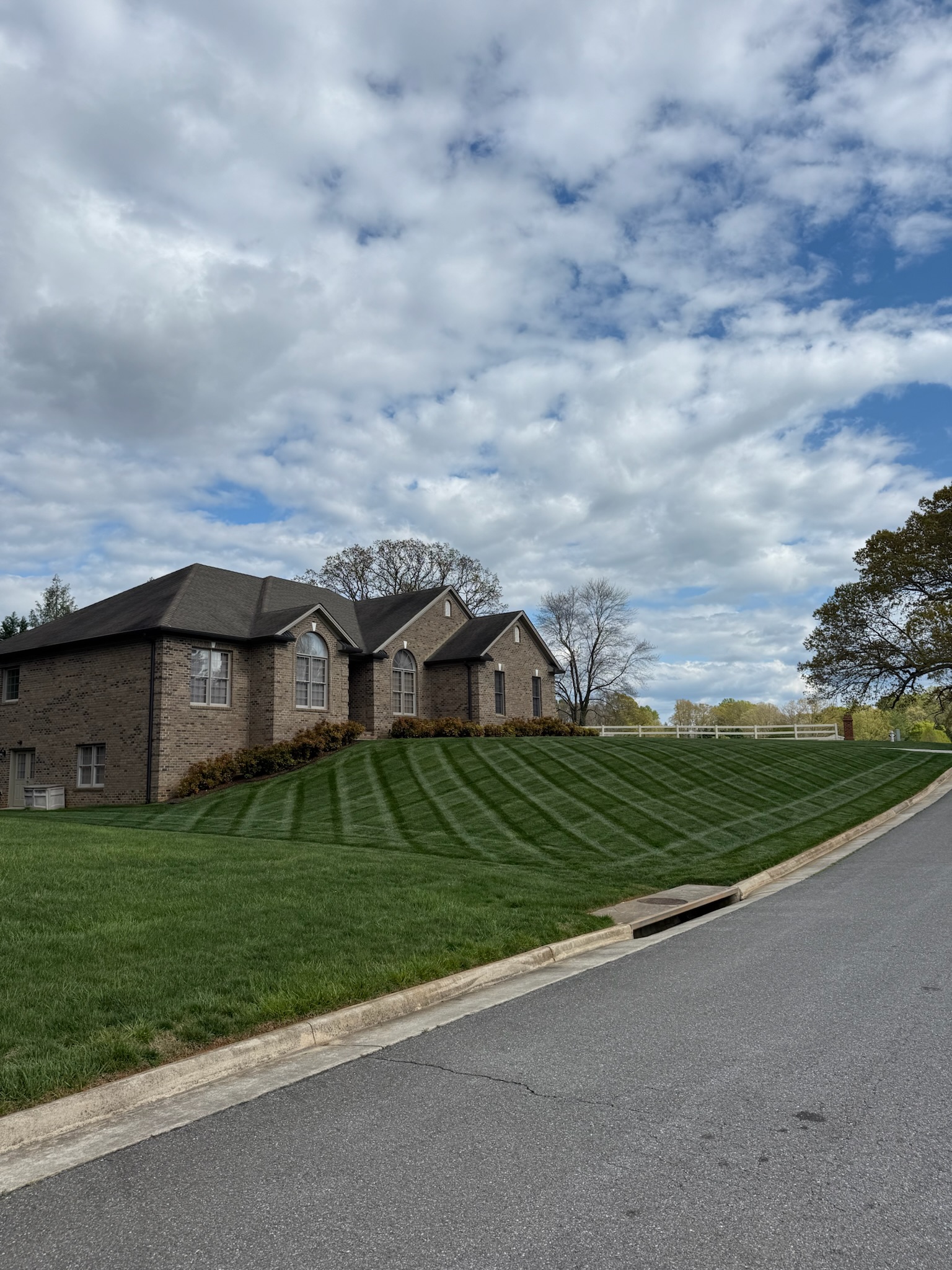 Crew mowing a residential lawn in Lynchburg, Virginia